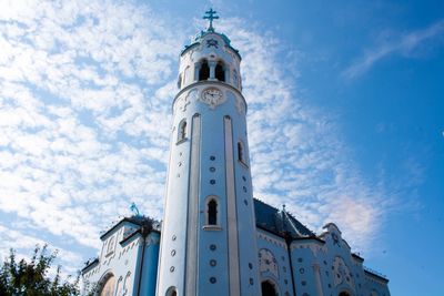 Low angle view of church and building against sky