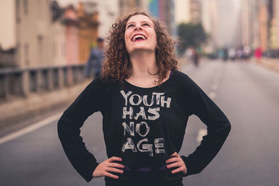 Portrait of a smiling young woman standing outdoors