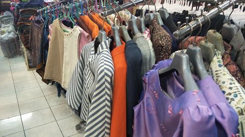 Close-up of clothes hanging at store