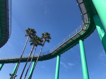 Low angle view of rollercoaster against sky