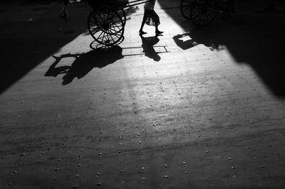 Low section of people walking on street