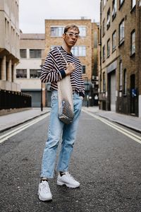 Full length of man standing on street in city