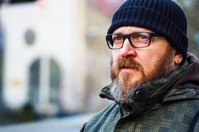 Man standing in city during winter