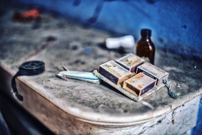 High angle view of old bottles on table