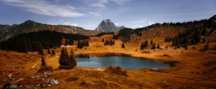 Scenic view of lake against sky during autumn