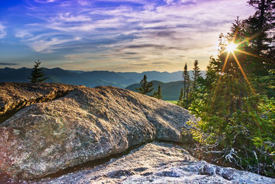 Panoramic view of rocks against sky during sunset