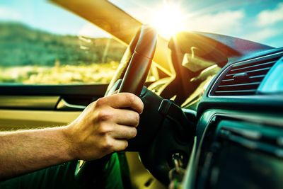 Close-up of man driving car