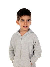 Portrait of smiling boy standing against white background