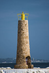 Low angle view of lighthouse against clear sky