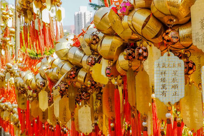 Close-up of decorations hanging at market stall