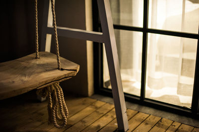 Close-up of old rope swing at home