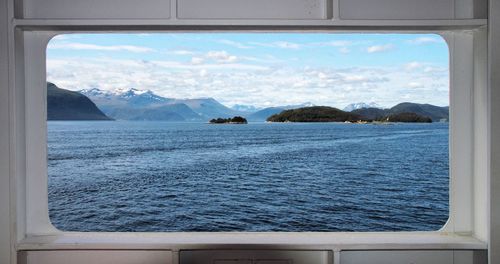 Scenic view of sea seen through window