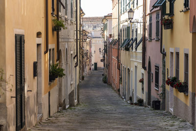 View of alley amidst buildings