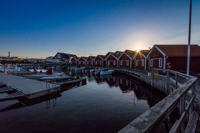 View of pier at harbor during sunset