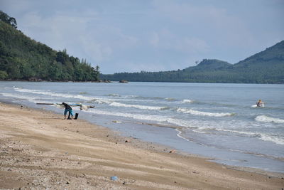 Scenic view of beach against sky