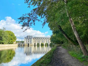 Arch bridge over canal against sky