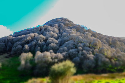 Close-up of volcanic mountain against sky