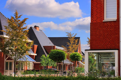 Exterior of houses in city against sky