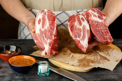 Close-up of person preparing food on table