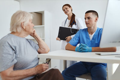 Two people working on table