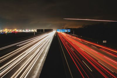 High angle view of light trails on highway at night