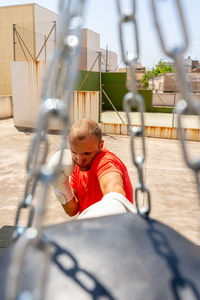 Rear view of boy sitting in bus