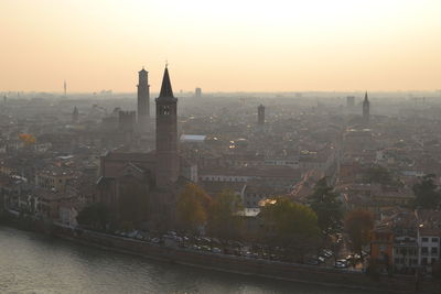Cityscape against sky during sunset