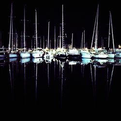 Boats moored at harbor