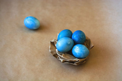 High angle view of multi colored eggs on table