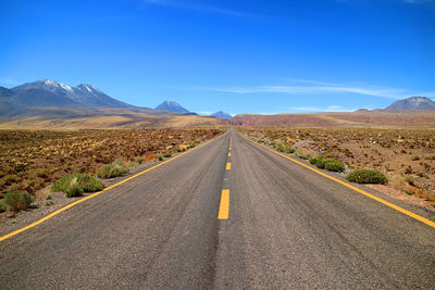 Empty desert road in the los flamencos national reserve, antofagasta region, northern chile