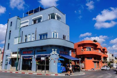 View of buildings against blue sky