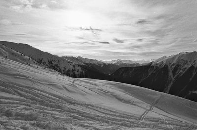 Scenic view of snowcapped mountains against sky