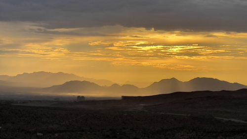 Scenic view of silhouette landscape against sky during sunset