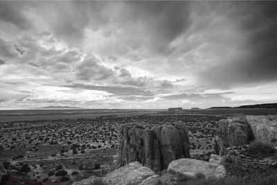 Scenic view of landscape against cloudy sky