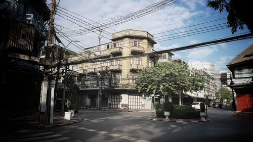 Street amidst buildings against sky