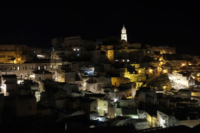 High angle view of illuminated buildings in city at night