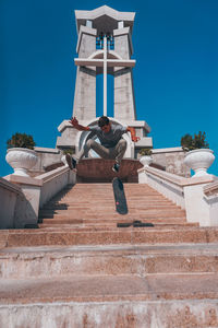 Skater doing an ollie trick at the church skateboard god skate jesus