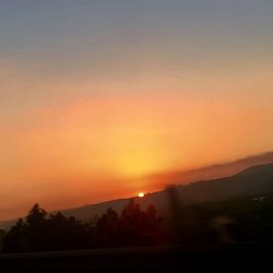 Scenic view of silhouette landscape against sky during sunset