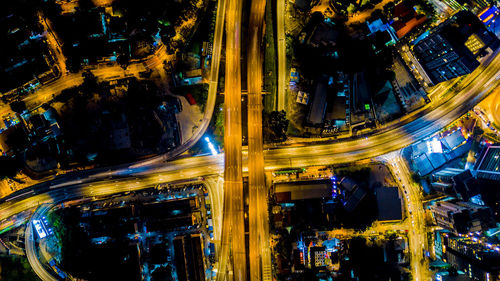 High angle view of light trails on road in city at night