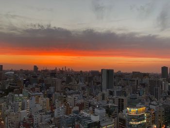 High angle view of buildings against sky during sunset