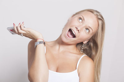 Portrait of a beautiful young woman over white background
