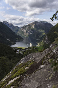 Scenic view of lake and mountains against sky