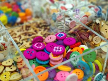 High angle view of multi colored candies in container