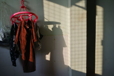 Clothes drying on wall at home