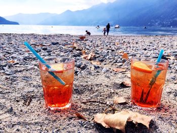 Close-up of drink at beach