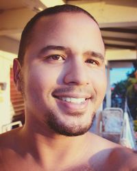 Close-up portrait of smiling young man