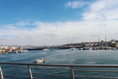 Boats in sea against sky