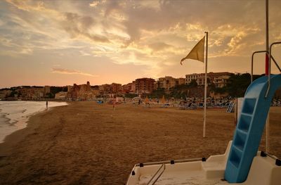 Scenic view of beach against sky during sunset