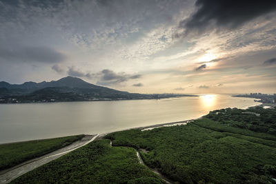 Scenic view of lake against sky during sunset