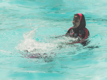 Man swimming in pool